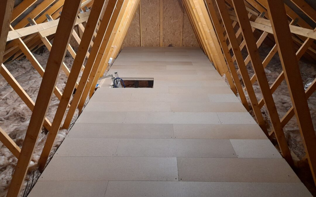 Raised loft boarding fitted above insulation in a loft